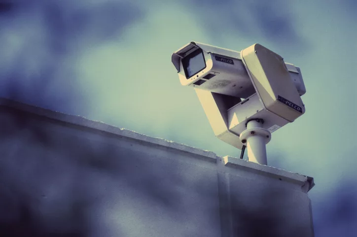 Surveillance camera on a wall