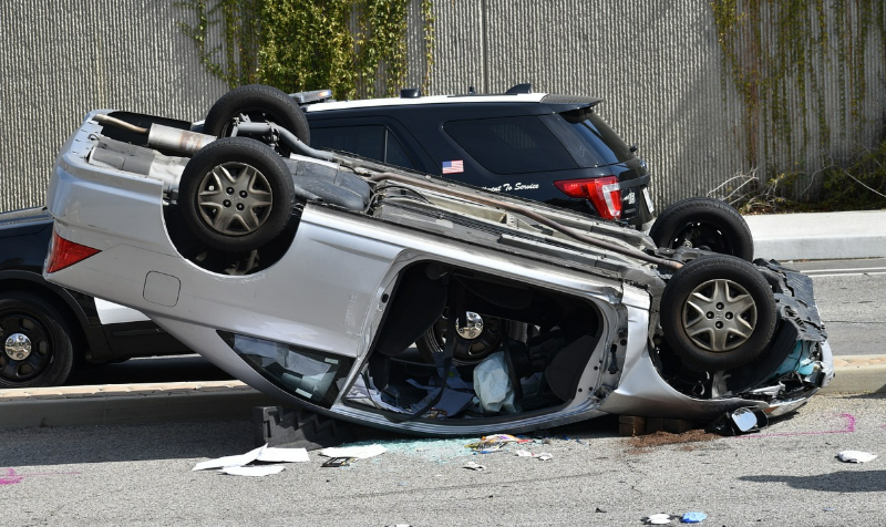 Serious car accident involving a rollover.